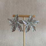 Make a statement with these Silver Leaf Earrings! With a bold and unique design, they are sure to add some flair to any outfit. Elevate your style and stand out from the crowd with these statement earrings.