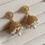 Elevate your jewellery collection with these stunning cute mini Jhumki earrings. Crafted with freshwater pearls and crystal zirconia, these earrings will instantly add a touch of modern elegance to any look.   Details: Earring drop 3.5cm.