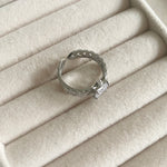 "Transform your look with our Crystal Cut Ring, adorned with sparkling cz crystals. This luxurious piece is both elegant and versatile, with an adjustable size to ensure the perfect fit. Elevate your style and make a statement with this exquisite ring." Adjustable one size.