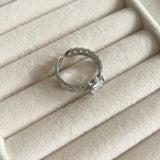 "Transform your look with our Crystal Cut Ring, adorned with sparkling cz crystals. This luxurious piece is both elegant and versatile, with an adjustable size to ensure the perfect fit. Elevate your style and make a statement with this exquisite ring." Adjustable one size.