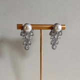 These stunning Hinali Pearl Crystal Earrings are the perfect accessory for any look. Featuring cz crystals for maximum sparkle and shine, a vintage-style, and a pearlescent accent, these earrings are sure to make a statement. Earring drop 3.5cm