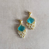 Add a pop of color to any outfit with our Ellie Aqua Pearl Drop Earrings! The luscious aqua stone and sparkling CZ crystals exude holiday vibes and add elegance to your look. Elevate your style and turn heads with these stunning earrings.